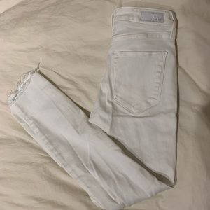 Ripped white ankle jeans with navy blue embroidery